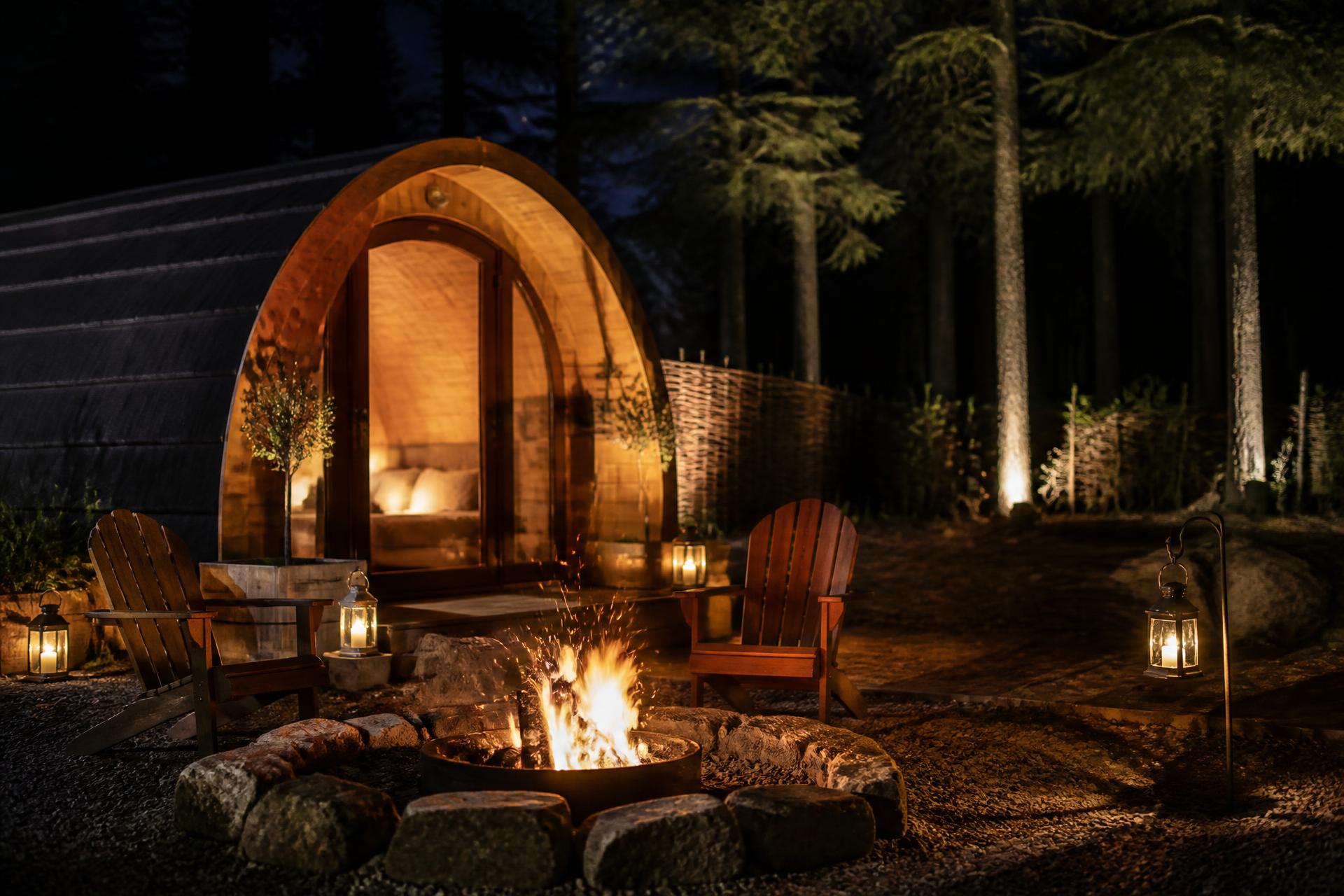 A fire outside the pod after dark