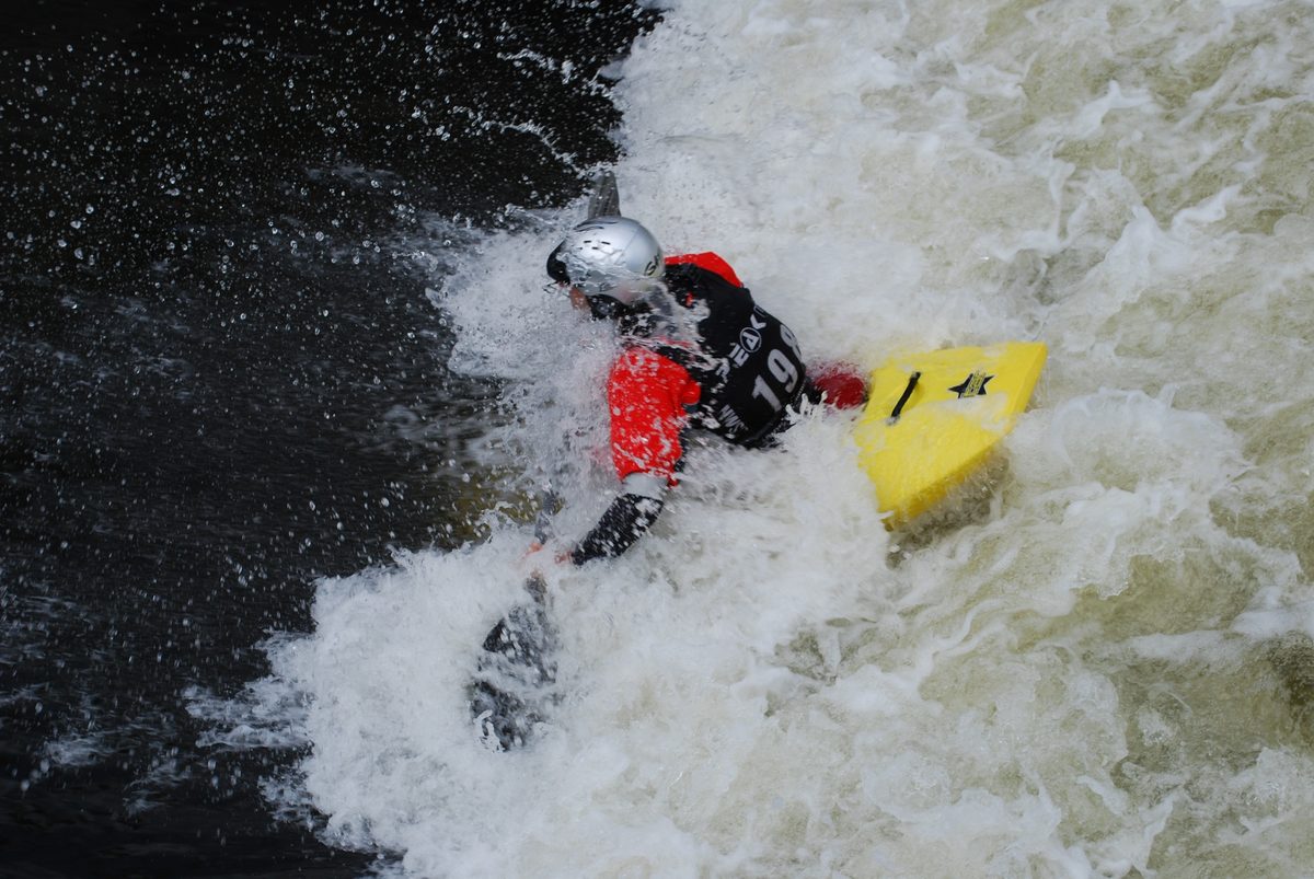 A kayaker in white water at Holme Pierrepont