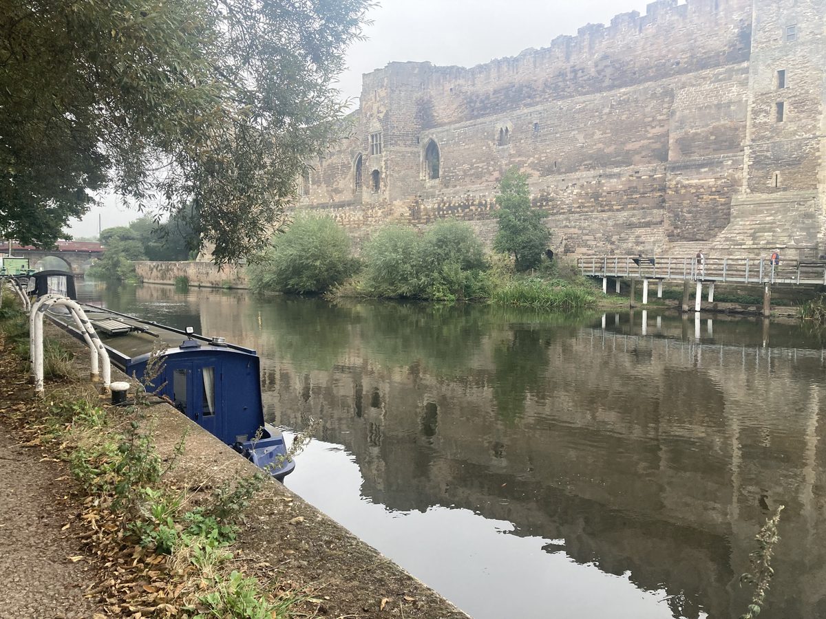 Newark Castle from the riverside with boats moored on the Trent